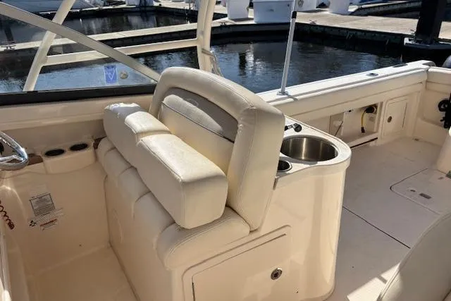  Yacht Photos Pics 2016 Grady-White Freedom 307 boat interior with seating and cup holders.