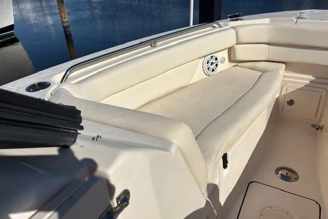  Yacht Photos Pics 2016 Grady-White Freedom 307 boat interior with cushioned seating and speaker.