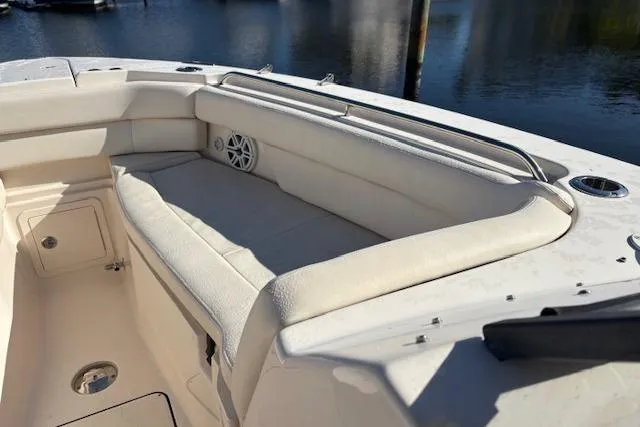 Yacht Photos Pics 2016 Grady-White Freedom 307 boat interior with cushioned seating and speaker.