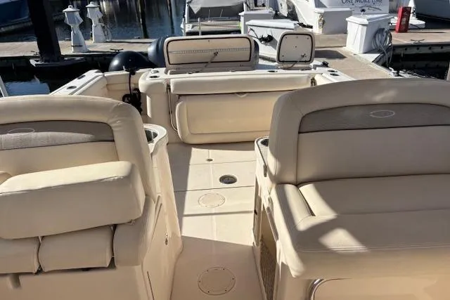  Yacht Photos Pics 2016 Grady-White Freedom 307 boat interior with beige seating at marina.