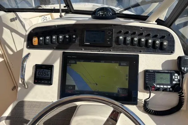  Yacht Photos Pics Control panel of 2016 Grady-White Freedom 307 boat with navigation and communication equipment.