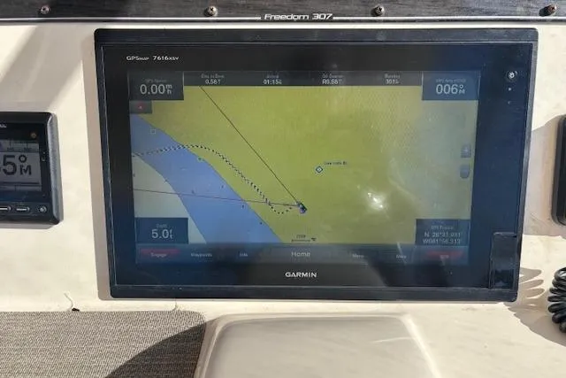  Yacht Photos Pics Garmin GPS display on 2016 Grady-White Freedom 307 boat dashboard.