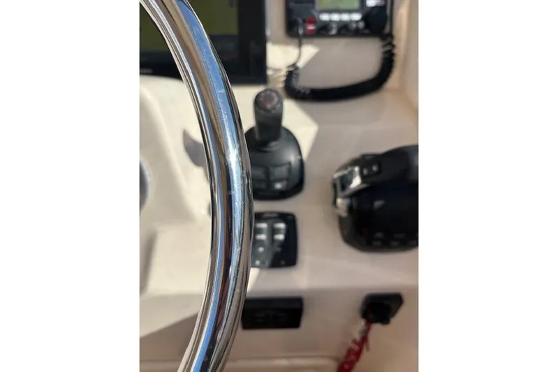  Yacht Photos Pics Steering wheel and controls of 2016 Grady-White Freedom 307 boat cockpit.