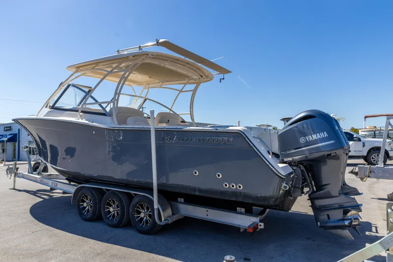  Yacht Photos Pics 2016 Grady-White Freedom 307 boat on trailer with Yamaha outboard motor.