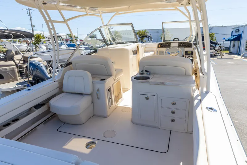  Yacht Photos Pics 2016 Grady-White Freedom 307 boat interior with seating and helm station.