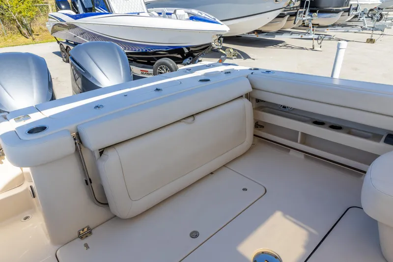  Yacht Photos Pics 2016 Grady-White Freedom 307 boat interior with seating and dual outboard motors.