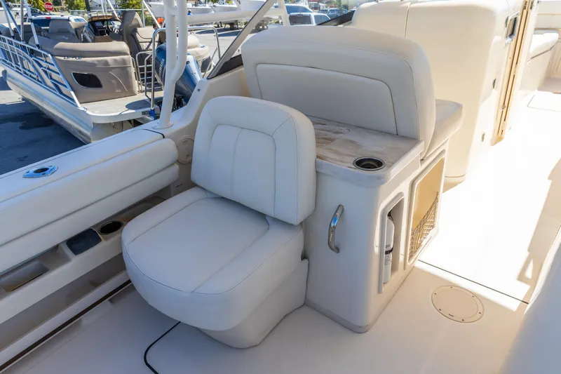  Yacht Photos Pics 2016 Grady-White Freedom 307 boat interior with comfortable seating and storage features.