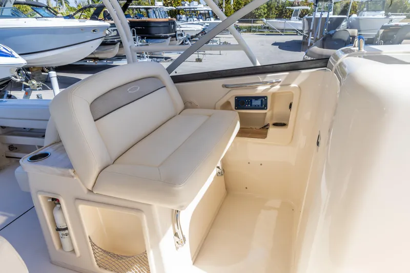 Yacht Photos Pics 2016 Grady-White Freedom 307 boat interior with seating and control panel.