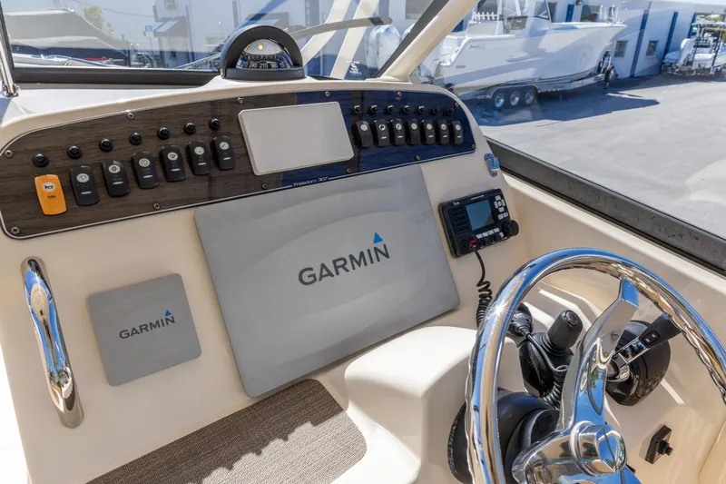  Yacht Photos Pics 2016 Grady-White Freedom 307 boat dashboard with Garmin navigation system.