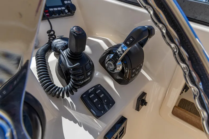  Yacht Photos Pics Control panel of 2016 Grady-White Freedom 307 boat with joystick and throttle.