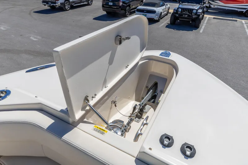  Yacht Photos Pics 2016 Grady-White Freedom 307 boat anchor compartment open in parking lot.
