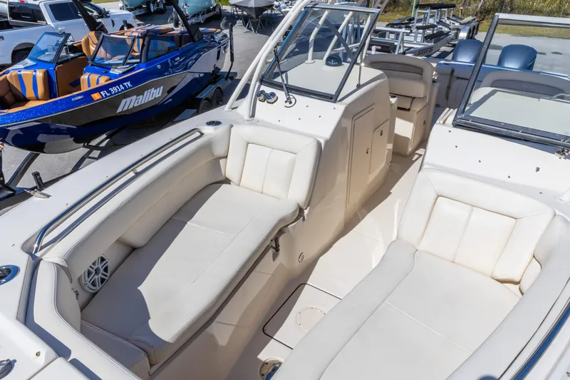  Yacht Photos Pics 2016 Grady-White Freedom 307 boat interior with white seating and dashboard view.