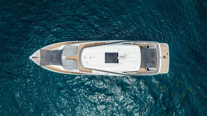 Cosa Bella Yacht Photos Pics Aerial view of 2024 Princess X80 yacht on clear blue water.