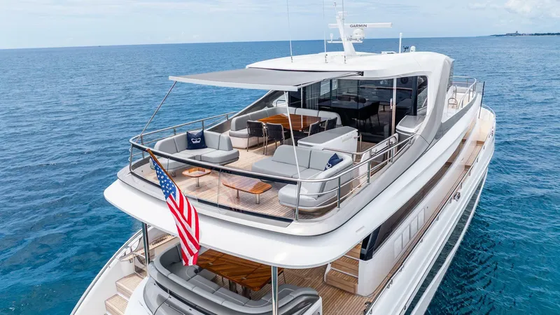 Cosa Bella Yacht Photos Pics Luxurious 2024 Princess X80 yacht on open sea, featuring spacious deck and elegant design.
