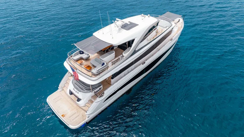 Cosa Bella Yacht Photos Pics Luxurious 2024 Princess X80 yacht cruising on clear blue waters.