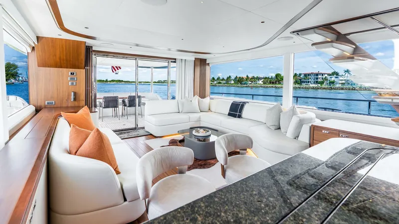 Cosa Bella Yacht Photos Pics Luxurious interior of 2024 Princess X80 yacht with elegant seating and scenic water views.
