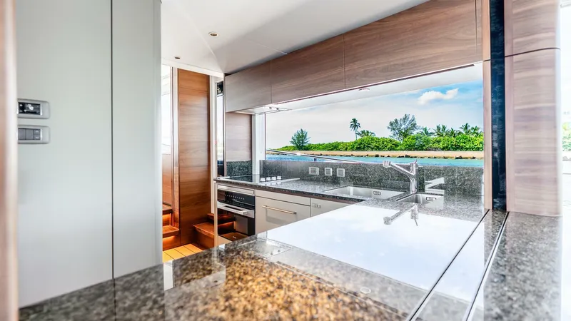 Cosa Bella Yacht Photos Pics Luxurious kitchen interior of 2024 Princess X80 yacht with ocean view.