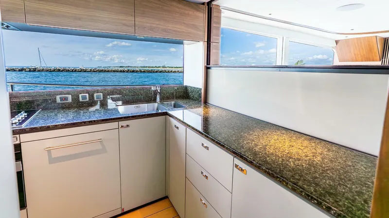 Cosa Bella Yacht Photos Pics Luxurious kitchen interior of 2024 Princess X80 yacht with ocean view.
