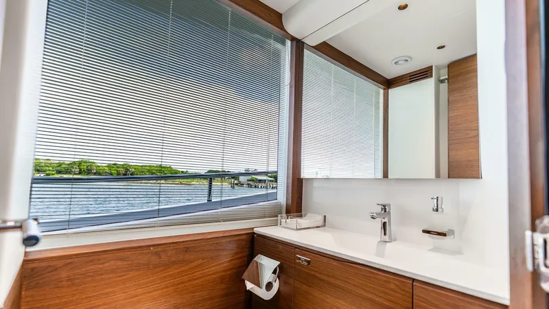 Cosa Bella Yacht Photos Pics Luxurious bathroom interior on 2024 Princess X80 yacht with modern fixtures and scenic window view.
