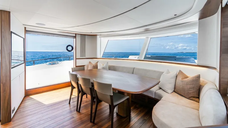 Cosa Bella Yacht Photos Pics Luxurious interior of 2024 Princess X80 yacht with ocean view and elegant dining area.