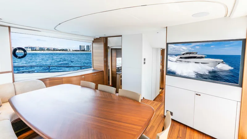 Cosa Bella Yacht Photos Pics Luxurious interior of 2024 Princess X80 yacht with ocean view and elegant dining area.