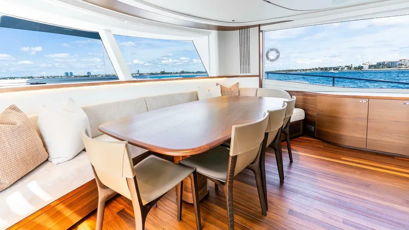 Cosa Bella Yacht Photos Pics Luxurious interior of 2024 Princess X80 yacht with elegant dining area and ocean view.