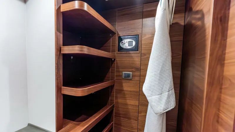 Cosa Bella Yacht Photos Pics Luxurious wooden closet with safe and robe in 2024 Princess X80 yacht.
