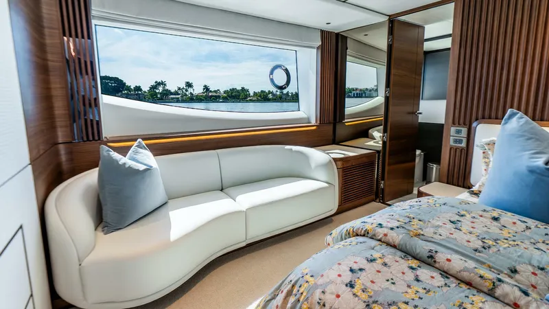Cosa Bella Yacht Photos Pics Luxurious interior of 2024 Princess X80 yacht with elegant seating and scenic window view.