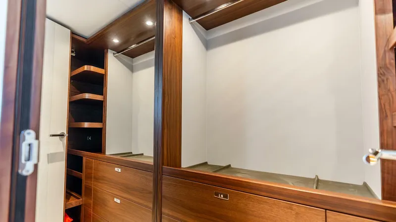 Cosa Bella Yacht Photos Pics Luxurious wooden wardrobe interior on 2024 Princess X80 yacht.