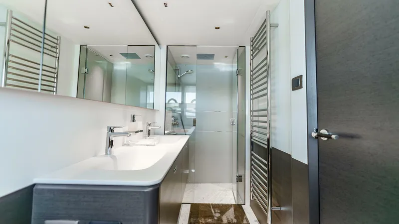 Cosa Bella Yacht Photos Pics Luxurious bathroom in 2024 Princess X80 yacht with modern fixtures and glass shower.