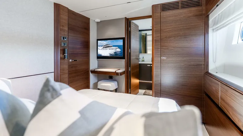 Cosa Bella Yacht Photos Pics Luxurious interior of 2024 Princess X80 yacht cabin with modern wood finishes.