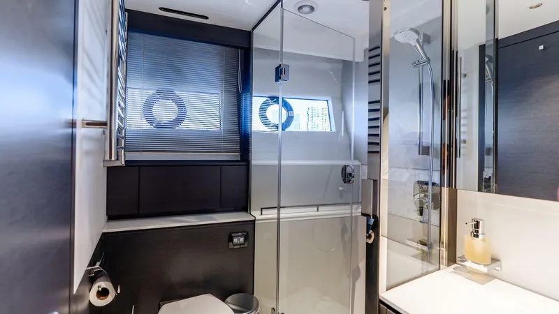 Cosa Bella Yacht Photos Pics Luxurious bathroom in 2024 Princess X80 yacht with modern fixtures and glass shower.