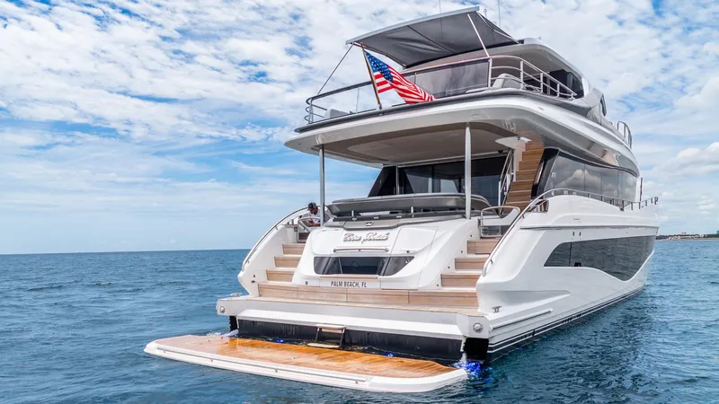 Cosa Bella Yacht Photos Pics Luxurious 2024 Princess X80 yacht on open sea with American flag.