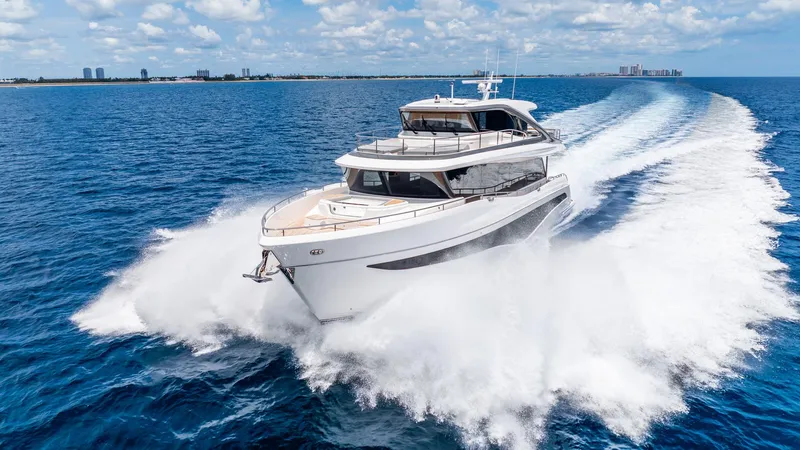 Cosa Bella Yacht Photos Pics Luxurious 2024 Princess X80 yacht cruising on open sea under clear skies.