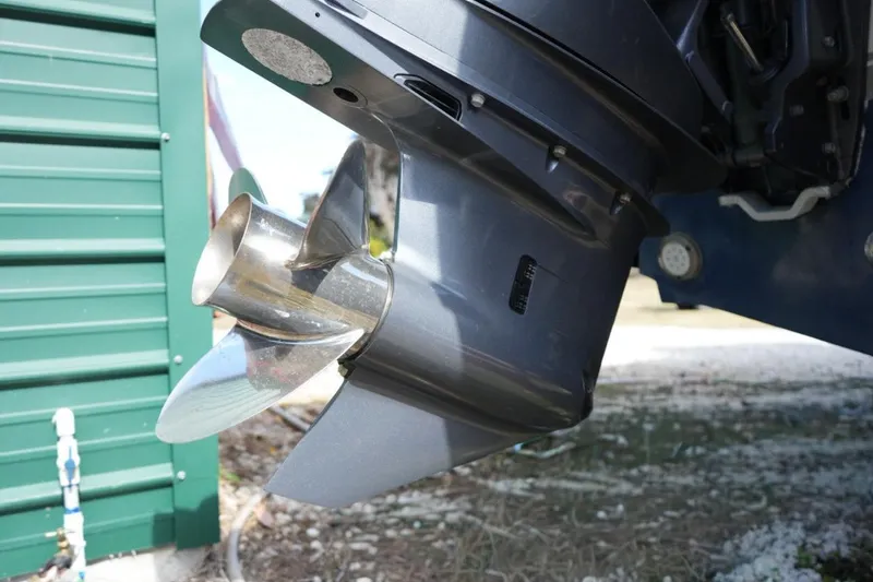  Yacht Photos Pics Close-up of a 2000 Contender 36 Open boat propeller and motor.