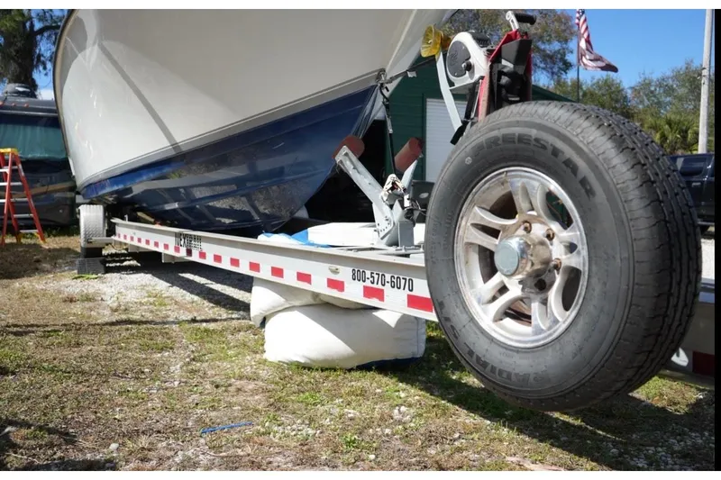  Yacht Photos Pics 2000 Contender 36 Open boat on trailer, close-up of wheel and hull.