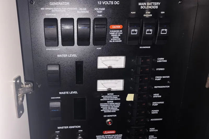 Keep The Faith Yacht Photos Pics Control panel of a 2005 Sea Ray 340 Sundancer boat, showing various switches and gauges.