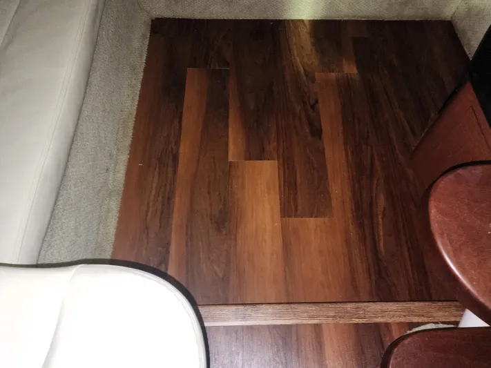 Keep The Faith Yacht Photos Pics Interior view of 2005 Sea Ray 340 Sundancer with wood flooring and beige seating.