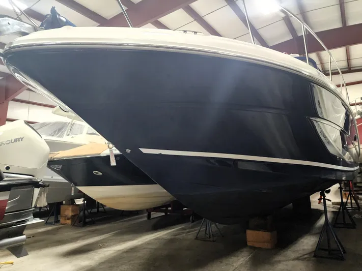 Keep The Faith Yacht Photos Pics 2005 Sea Ray 340 Sundancer boat in indoor storage, viewed from the front.