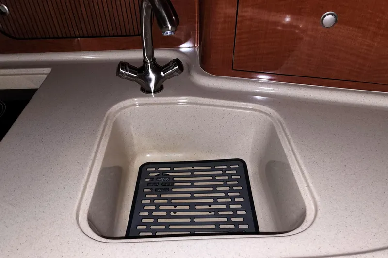 Keep The Faith Yacht Photos Pics 2005 Sea Ray 340 Sundancer kitchen sink with modern faucet and countertop.