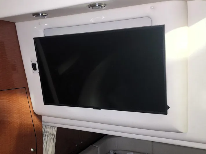 Keep The Faith Yacht Photos Pics Flat-screen TV inside 2005 Sea Ray 340 Sundancer yacht cabin.