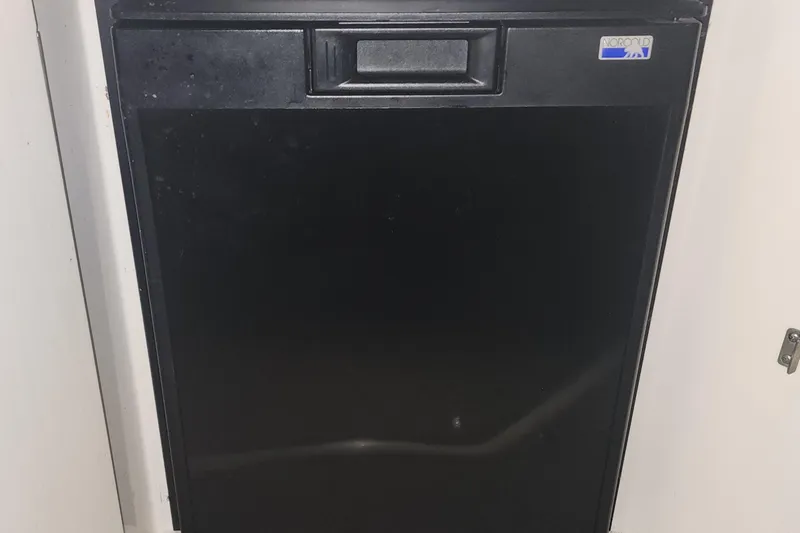 Keep The Faith Yacht Photos Pics Black refrigerator in a 2005 Sea Ray 340 Sundancer boat interior.