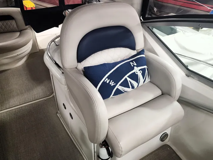 Keep The Faith Yacht Photos Pics Captain's chair on 2005 Sea Ray 340 Sundancer with nautical-themed pillow.