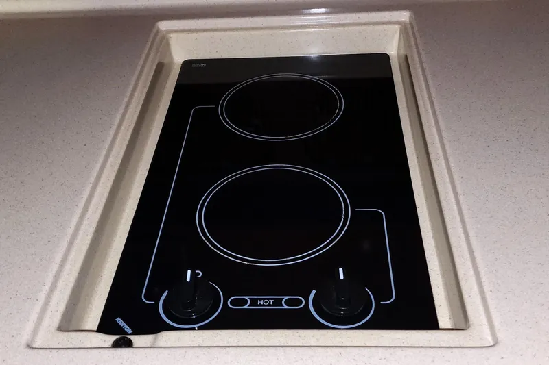 Keep The Faith Yacht Photos Pics Ceramic cooktop on 2005 Sea Ray 340 Sundancer yacht kitchen counter.