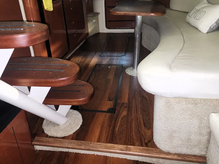 Keep The Faith Yacht Photos Pics Interior of 2005 Sea Ray 340 Sundancer with wooden steps and seating area.
