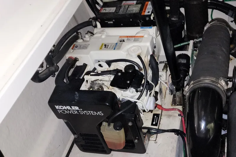 Keep The Faith Yacht Photos Pics Engine compartment of 2005 Sea Ray 340 Sundancer with Kohler power system.