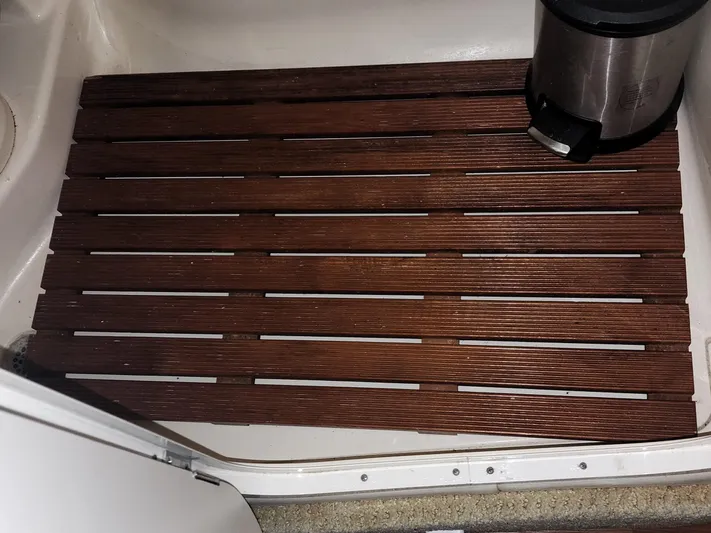Keep The Faith Yacht Photos Pics Wooden slatted floor mat on 2005 Sea Ray 340 Sundancer boat interior.