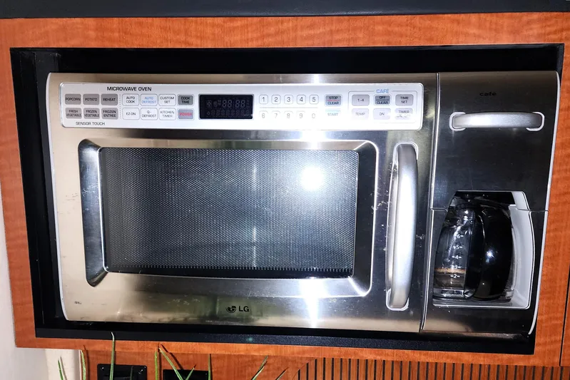 Keep The Faith Yacht Photos Pics LG microwave and coffee maker combo in a 2005 Sea Ray 340 Sundancer yacht.