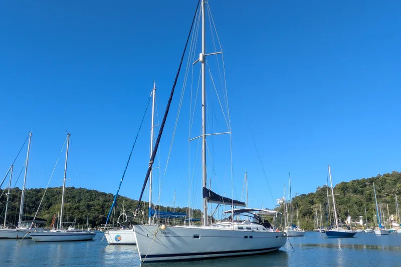 Laylay Yacht Photos Pics 2003 Beneteau Oceanis Clipper 473 sailboat docked in a serene marina setting.