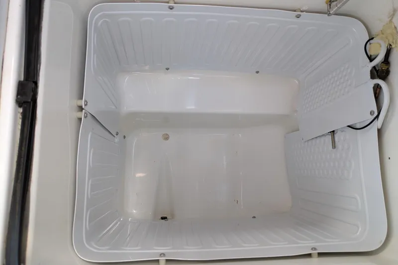 Laylay Yacht Photos Pics Empty storage compartment on a 2003 Beneteau Oceanis Clipper 473 sailboat.